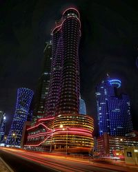 Low angle view of modern building at night