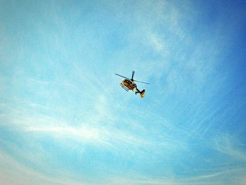 Low angle view of airplane flying in sky