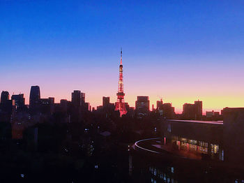 View of buildings in city at sunset