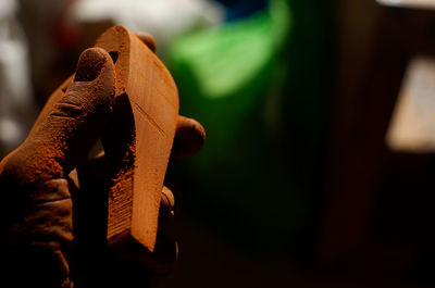 Close-up of old toy on wood