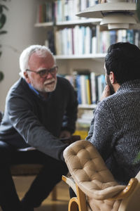 Senior therapist counseling patient during therapy session