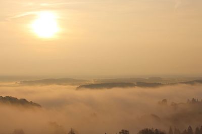 Scenic view of landscape against sky during sunset