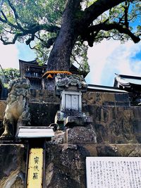 Low angle view of statue against building