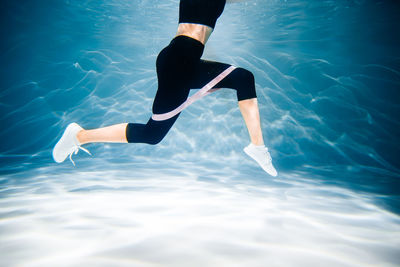 Low section of man in swimming pool