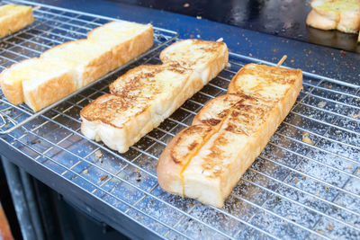 High angle view of meat on barbecue grill