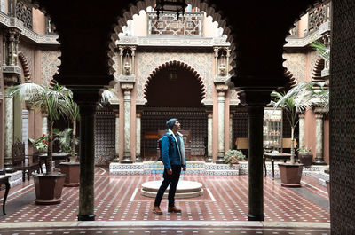 Full length of man walking in historic building