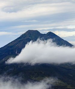 Scenic view of volcanic mountain against sky