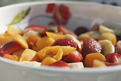 Close-up of chopped fruits in bowl