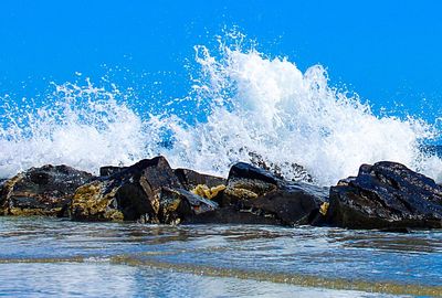 Panoramic view of sea against clear blue sky