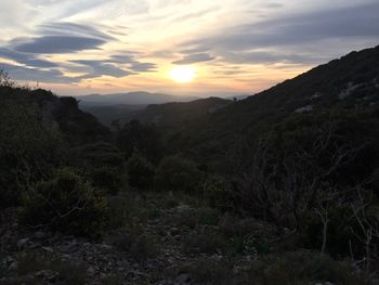 Scenic view of landscape against sky during sunset