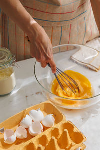 Cropped hand of person preparing food