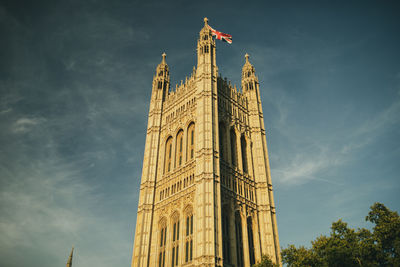 Low angle view of clock tower against sky in city