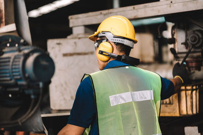 Rear view of men working