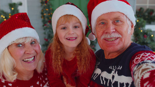 Close-up portrait of grandparents with granddaughter