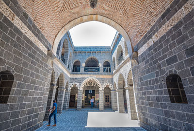 People walking in historic building