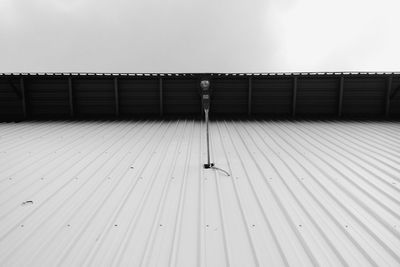 View of bird on wall against sky