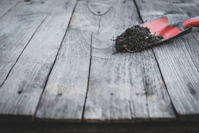 High angle view of leaves on wooden table