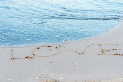 High angle view of heart shape on beach