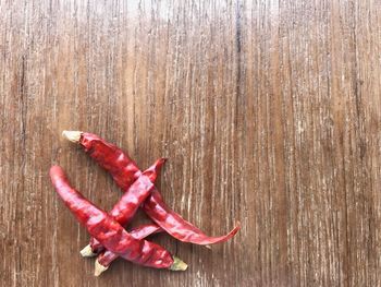High angle view of red chili peppers on table