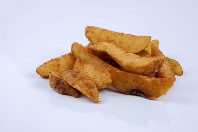 Close-up of cake against white background