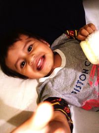 Portrait of cute boy holding baby