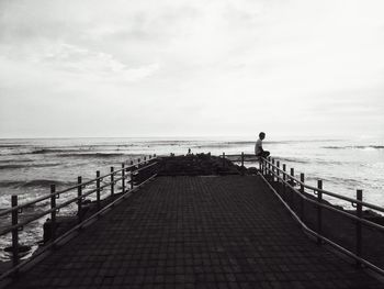 Pier on sea against sky