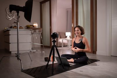 Yoga trainer speaking with online clients