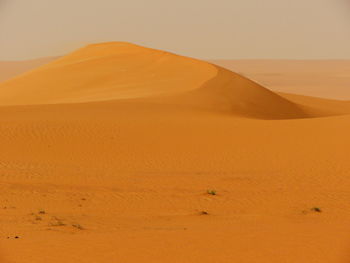 Scenic view of desert against clear sky