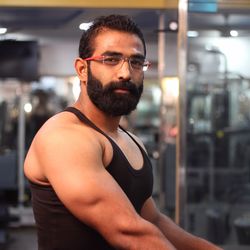 Portrait of bearded man in gym