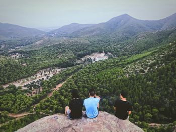 High angle view of people sitting on mountain