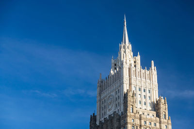 Low angle view of historical building against blue sky