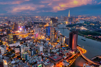 High angle view of illuminated city buildings against sky