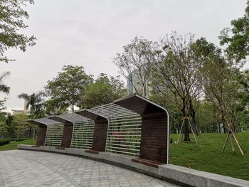 House by trees against sky