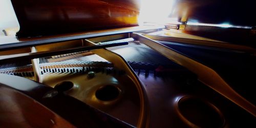 High angle view of illuminated candles on table