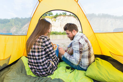 People sitting at tent