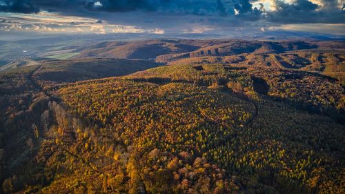 Aerial view of landscape against cloudy sky