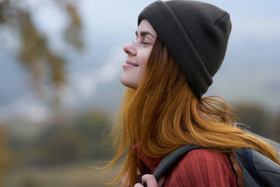 Portrait of young woman with eyes closed