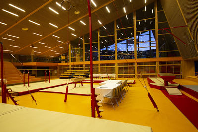 High angle view of empty chairs and tables in building