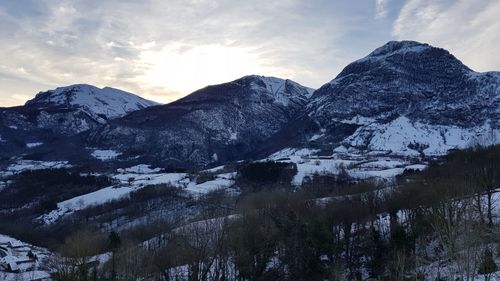 Scenic view of mountains against sky during winter