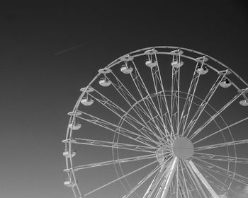 Low angle view of ferris wheel against sky at night