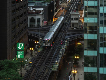 Illuminated city street and buildings at night