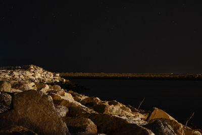 Scenic view of sea against sky at night