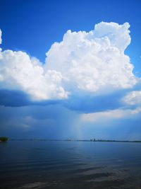 Scenic view of sea against blue sky