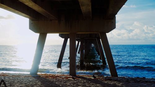 Pier over sea against sky