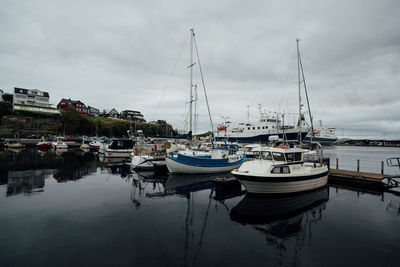 Boats moored at harbor