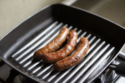 High angle view of meat on barbecue grill