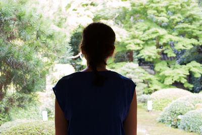 Rear view of man standing outdoors