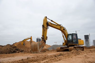 Excavator at building under construction. backhoe digs the ground for the foundation 