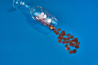 High angle view of bottle on blue background