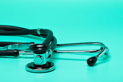 Close-up of eyeglasses on blue background